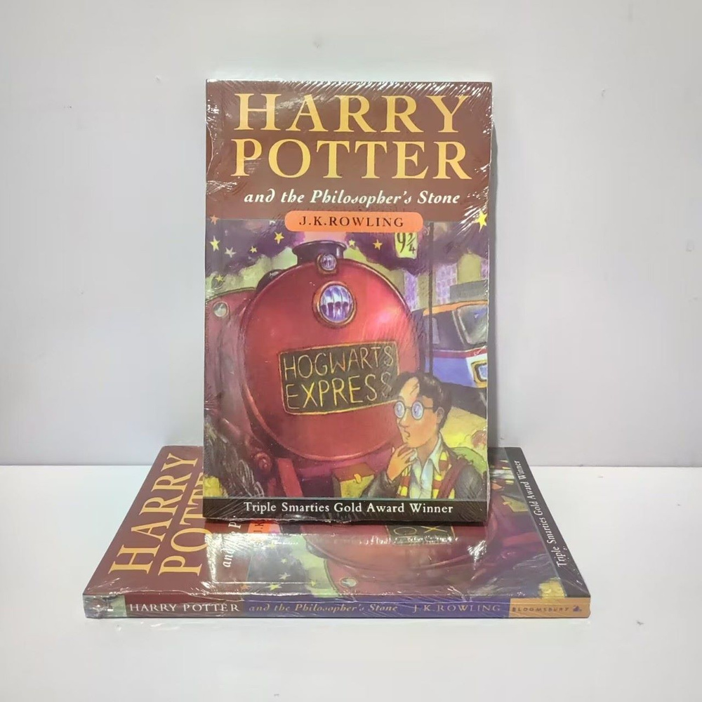 Книга на английском языке Harry Potter and the Philosopher's Stone by J.K. Rowling  #1