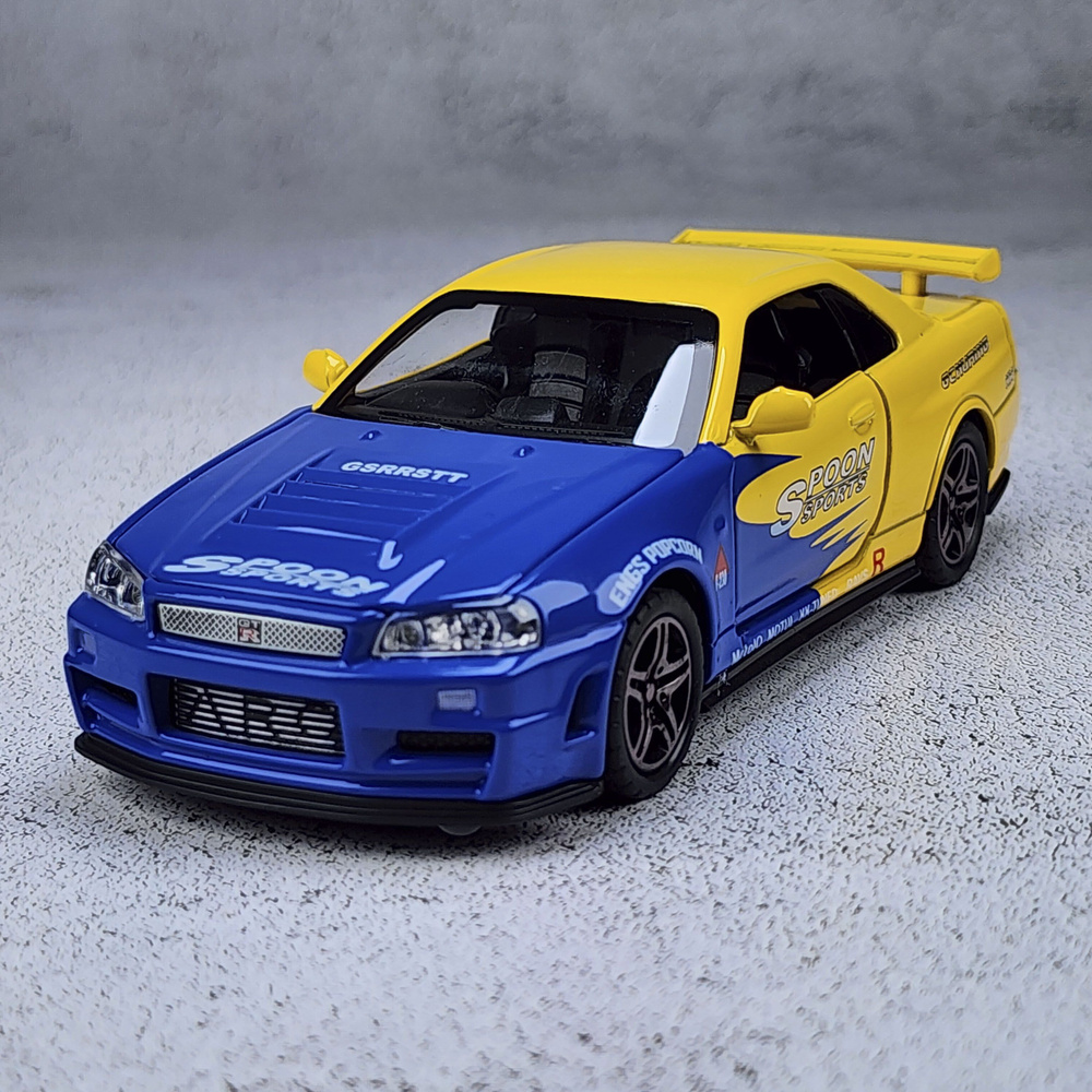 Модель автомобиля Nissan Skyline GT-R R34 инерционная машинка 1:28 длина 14.5см, со светом и звуком  #1