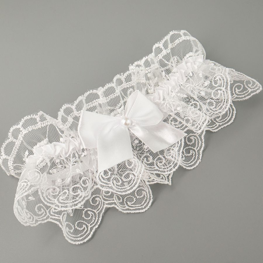 Подвязка для невесты кружевная в белом цвете с бантиком9.  #1