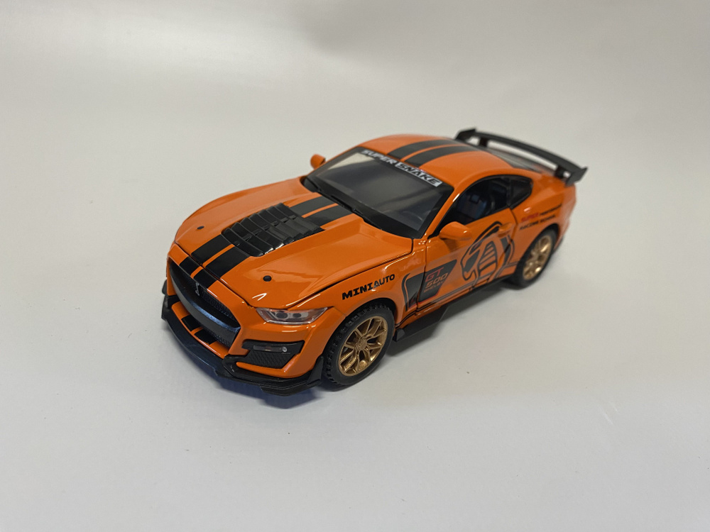 Машинка металлическая инерционная Ford Mustang Shelby оранжевый длина 16см масштаб 1:32, модель со светом #1