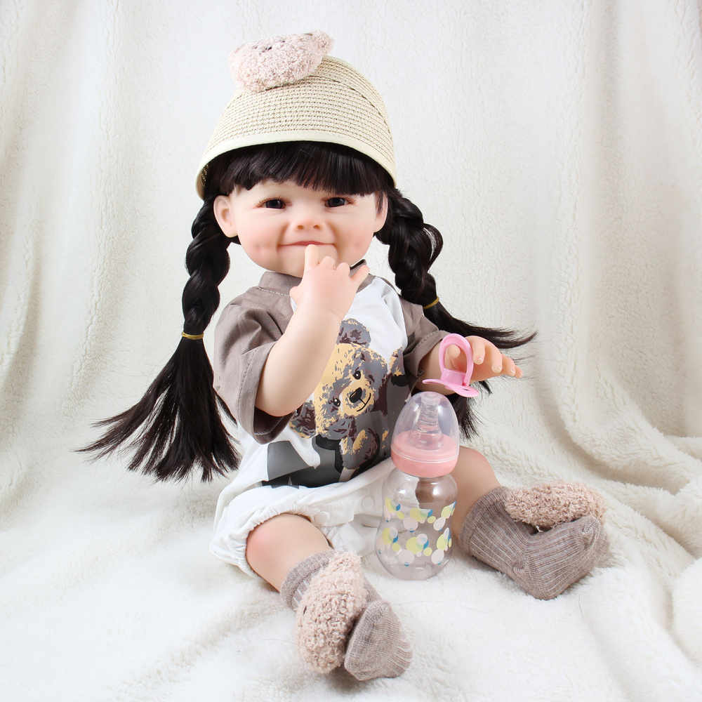 Виниловая кукла Реборн (Reborn Dolls) - Девочка в свитере с мишкой, с улыбкой (56 см)  #1
