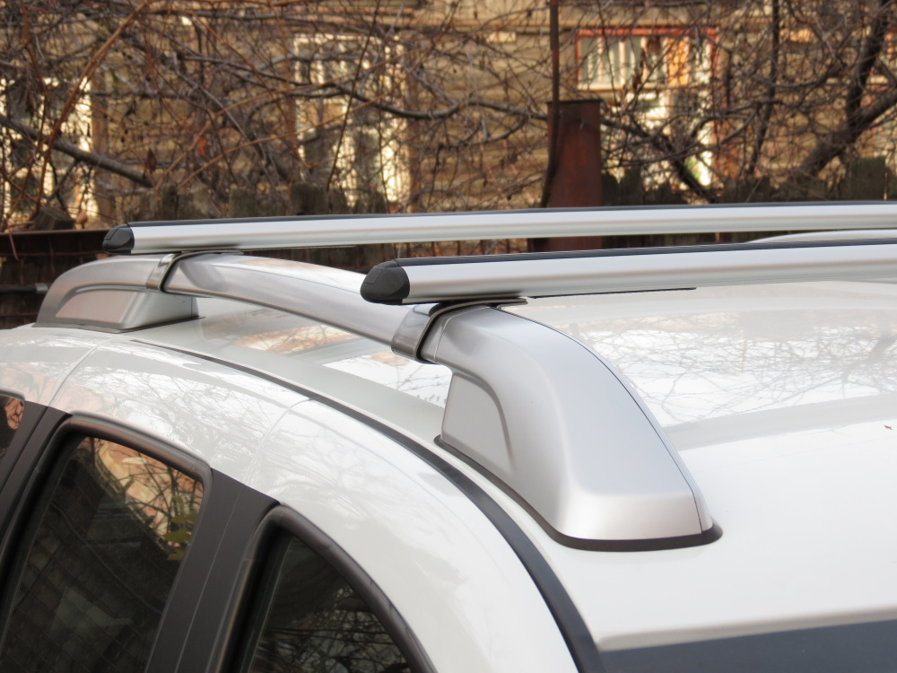 Багажник на рейлинги Nissan Terrano / Ниссан Террано 2014 - дуга аэро-стандарт 73мм алюмин / silver опоры #1
