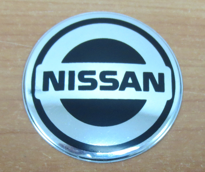 Наклейка "Nissan" (диаметр 70мм.) на автомобильные колпаки, диски, компл. 4шт.  #1