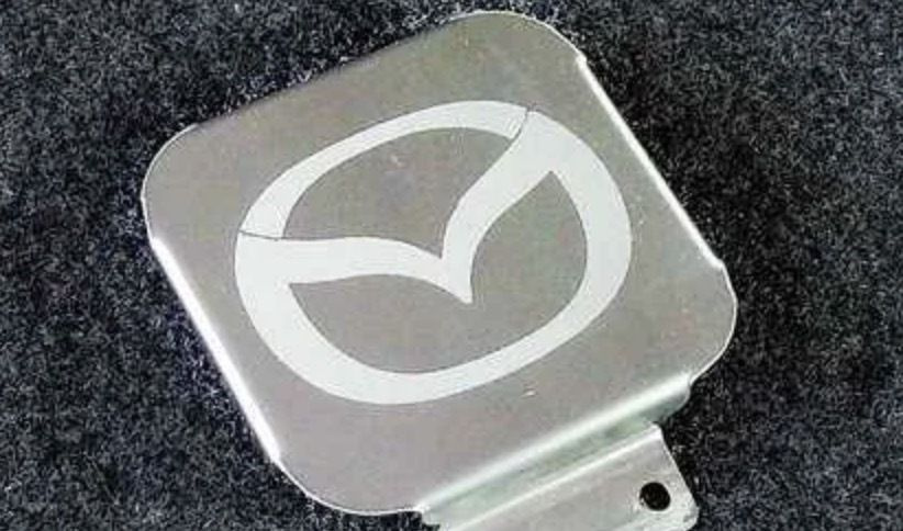 Заглушка на фаркоп под квадрат 50x50 с логотипом Mazda, (нерж.сталь) TCUMAZ1  #1