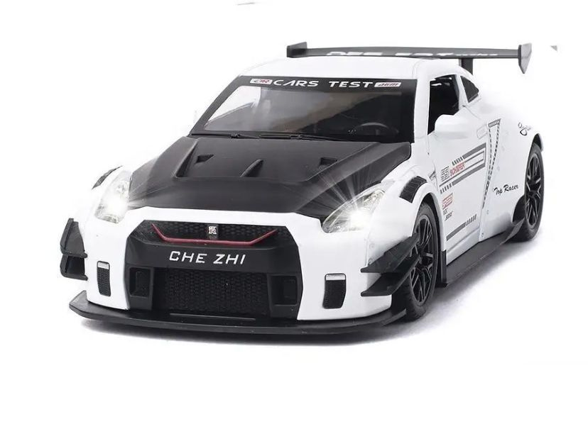 Машинка металлическая "Nissan Gtr" белая 1:24, свет+звук инерционный/ в подарок ящерица тянучка  #1