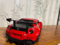 Коллекционная модель машинки Nissan Skyline GT-R R35 (Ниссан ГТР) Годзилла, масштаб 1:24, открываются двери, капот, багажник, свет фар, звук мотора #38, Ляйсан М.