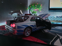 Коллекционная модель машинки Nissan Skyline GT-R R34 (Ниссан ГТР) масштаб 1:24 #63, .