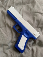 Игрушечный пистолет с выбросом гильз и мягкими пулями Glock нерф (Глок) синего цвета #52, Полина Потапова