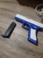 Игрушечный пистолет с выбросом гильз и мягкими пулями Glock нерф (Глок) синего цвета #74, Ярослав ш.