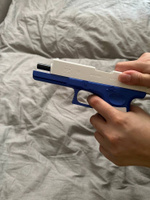 Игрушечный пистолет с выбросом гильз и мягкими пулями Glock нерф (Глок) синего цвета #54, Полина Потапова