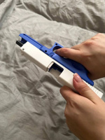 Игрушечный пистолет с выбросом гильз и мягкими пулями Glock нерф (Глок) синего цвета #53, Полина Потапова
