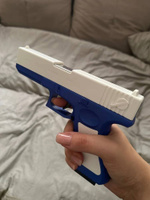 Игрушечный пистолет с выбросом гильз и мягкими пулями Glock нерф (Глок) синего цвета #55, Полина Потапова