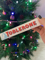 Toblerone шоколад белый с медово-миндальной нугой, 100 г #31, Конфетка С.
